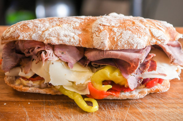Il Manzo comes loaded with rare roast beef, provolone, mild pickled peppers, roast capsicum, red onion and Dijon mustard.