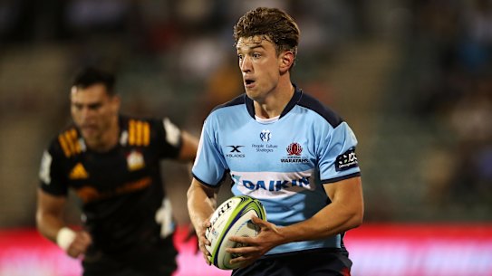 Waratahs winger James Ramm runs the ball.