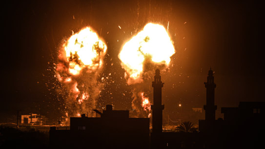 Flames are seen after an Israeli air strike hit Hamas targets in Gaza City, breaking a ceasefire agreed last month.