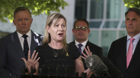 Veteran suicide campaigner Julie-Ann Finney, flanked here by Opposition leader Anthony Albanese and Labor MPs, says families won't be placated by the government's alternative to a royal commission.