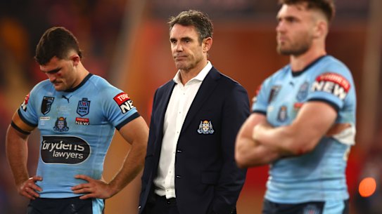 A dejected Brad Fittler with vanquished Blues Nathan Cleary and Angus Crichton.