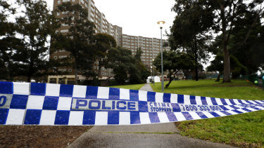 Police tape outside the public housing tower on Alfred Street when it was locked down in July.