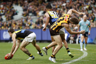Marlion Pickett bumped Hawk Dylan Moore in the second quarter of Saturday’s match the MCG.