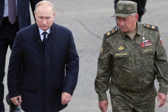Russian President Vladimir Putin, left, and Russian Defence Minister Sergei Shoigu attend a joint strategic exercise at a training ground in the Nizhny Novgorod region.