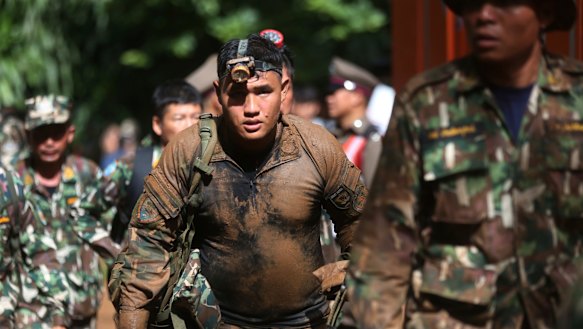Thai soldiers march out of the Tham Luang Nang Non cave in Mae Sai, Chiang Rai province.