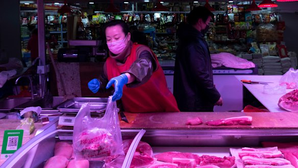 Li Huiying, 36, a butcher at a suburban market in eastern Beijing