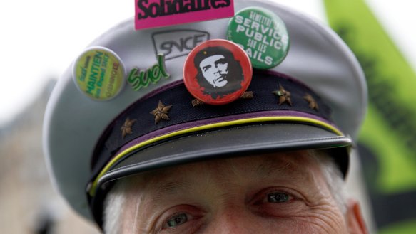 A french rail worker demonstrates in Paris, on Tuesday.