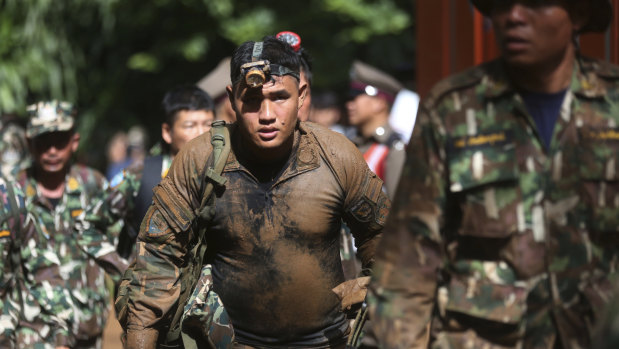 Thai soldiers march out of the Tham Luang Nang Non cave in Mae Sai, Chiang Rai province.