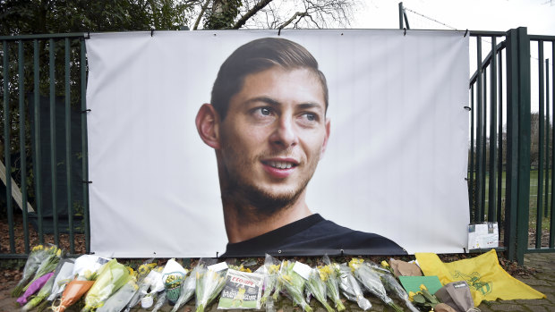 Tribute: Flowers near a giant picture of Emiliano Sala outside FC Nantes.