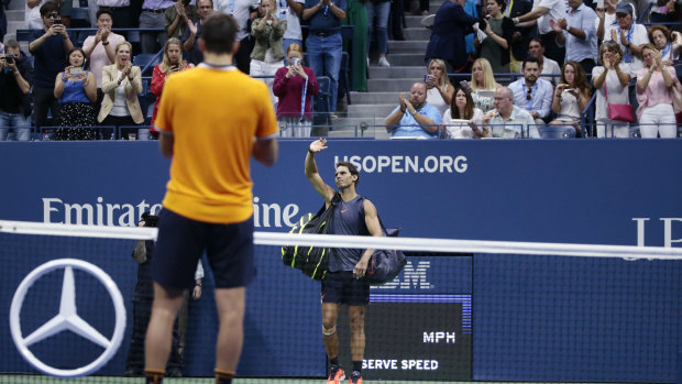 Light work: Del Potro watches on as Rafael Nadal withdraws from their US Open semi-final.