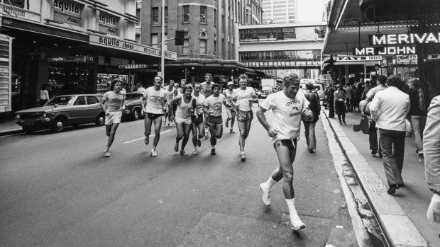 The City Tattersalls Harriers runners on Castlereagh Street, led by gymnasium director George Daldry.