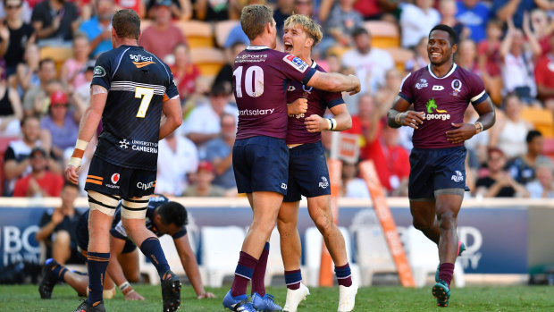 Queensland's Tate McDermott celebrates with Bryce Hegarty in their win over the Brumbies on Sunday.