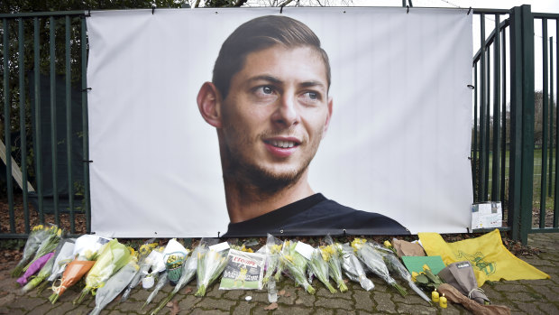 Flowers and tributes are placed near a giant picture of Emiliano Sala outside the FC Nantes training camp in western France