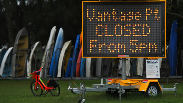 A sign displaying COVID-19 messaging in Tingira Memorial Park, which has been closed as a precaution against coronavirus, at Rose Bay in Sydney. 