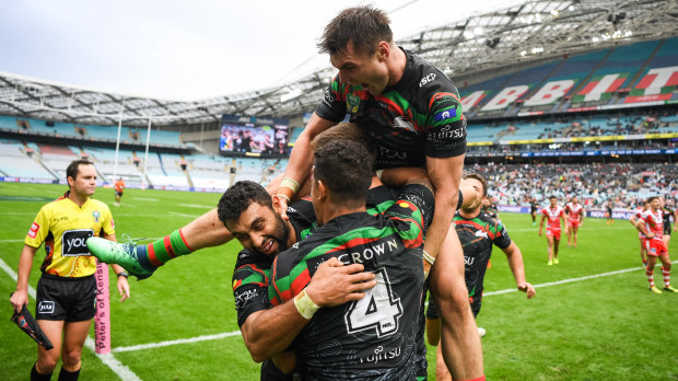 Elated: South Sydney celebrate on their way to an impressive win over the ladder-leading Dragons.
