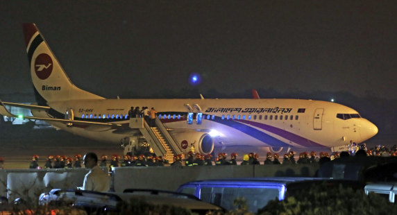 The Biman Bangladesh Airlines flight is seen after making an emergency landing at the airport in Chittagong.