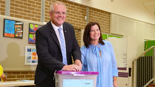 Scott Morrison and wife Jenny on polling day in 2019. While polls and betting markets missed the result, economic models picked a Coalition victory.