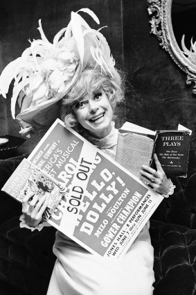Carol Channing holds a sold out advertisement poster of Hello, Dolly in Houston in 1967.