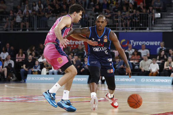 Melbourne United debutant Xavier Rathan-Mayes drives to the basket against the New Zealand Breakers.