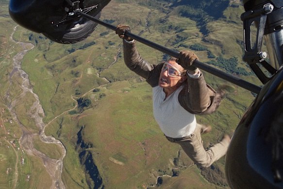 Tom Cruise says preparing for a stunt when he hung off the wing of a plane took “decades”.