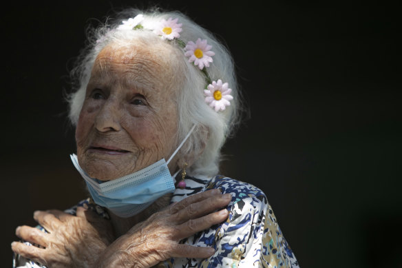 Zelia de Carvalho Morley, 106, gestures before receiving a shot of China's Sinovac CoronaVac vaccine at the retirement home where she lives in Rio de Janeiro, Brazil.