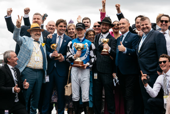 The owners of Gold Trip celebrate with winning jockey Mark Zahra.