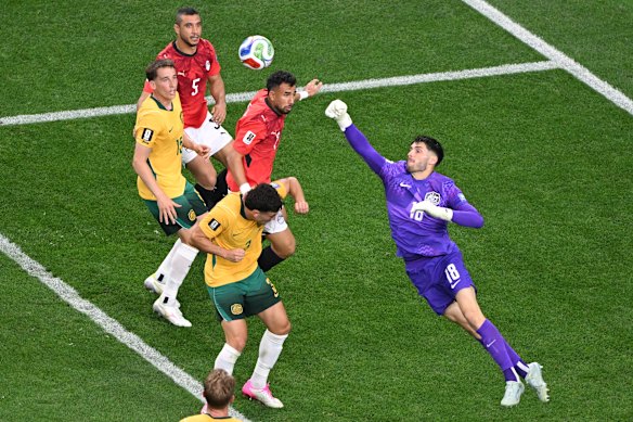 Patrick Beach punches the ball.