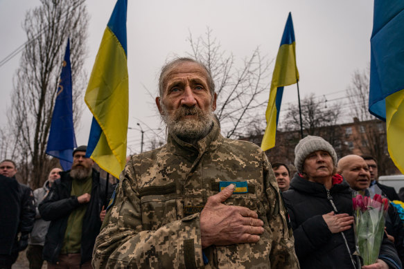 Valeriy Kocherga, 75, joins other Ukrainians as they gather for the annual memorial for the victims of a 2015 bombing in Kharkiv, Ukraine, on February 22. 