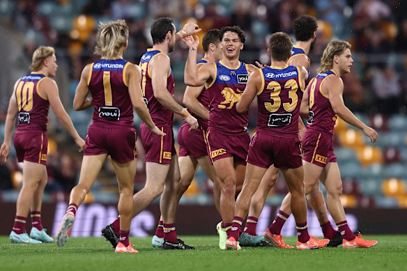 The Lions celebrate one of their six first-quarter goals.
