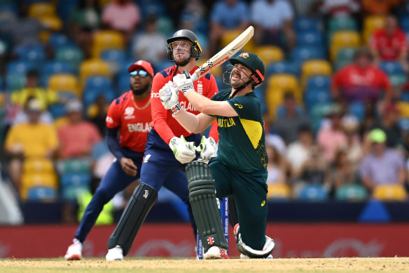 Travis Head smashes a six in Australia’s 36-run win against England in Barbados on Sunday.