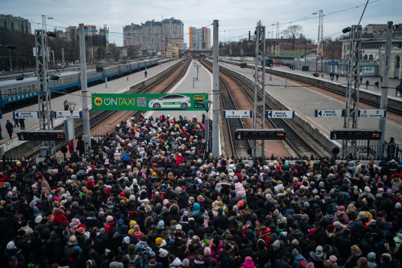 A crowd of mainly Ukrainian women and children wait to board a train to Lviv from the station in downtown Odessa on Saturday. 