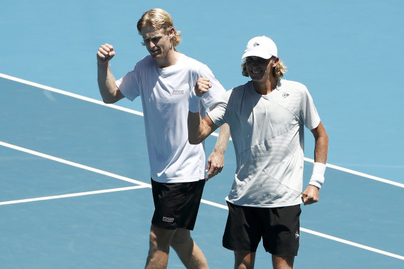 Luke Saville and Max Purcell celebrate after winning their semi-final.
