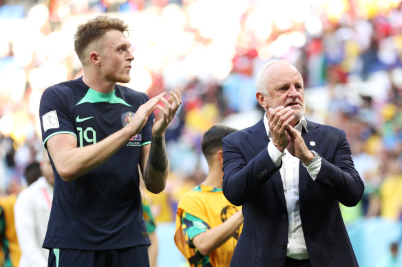 Towering defender Harry Souttar and Socceroos coach Graham Arnold.