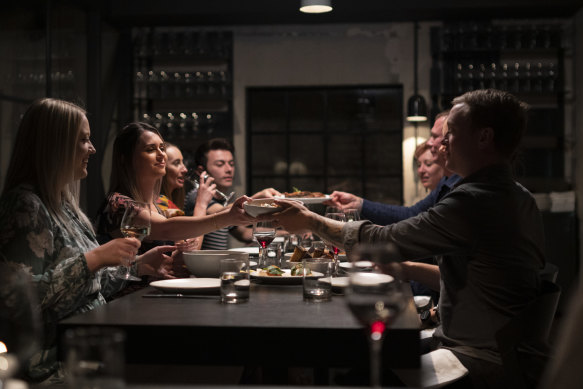 Diners at Agnes restaurant, enjoying the city’s vibrant food scene.