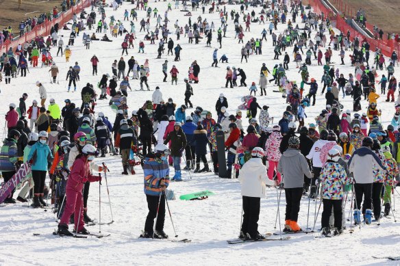 Beijing residents flock to the ski resorts outside the capital before the Winter Olympics, where snowmaking machines have been busy covering the runs.