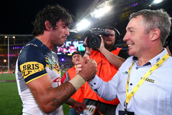 Paul Green celebrates the 2015 premiership win with Cowboys talisman Johnathan Thurston.