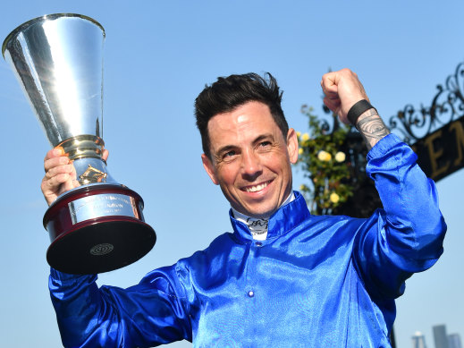 Dean Holland celebrates a win at Flemington this year.