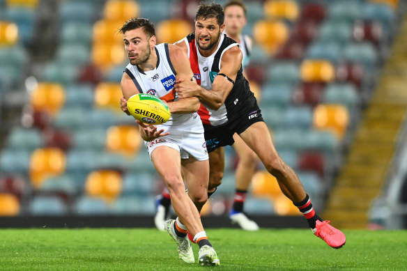 Stephen Coniglio is put under pressure by Paddy Ryder.