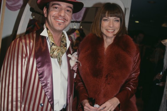 Galliano and Wintour at a party at Bergdorf Goodman (1998). Wintour nurtured a young Galliano’s career, helping him secure positions and Givenchy and Dior.