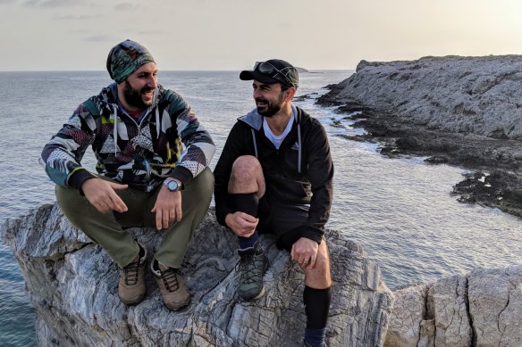 Stavros Tziortzis (left) and Yalçın Adal.  “Every day we walked for about 10 hours, each carrying an olive branch like a baton. I for him in the north, him for me in the south.”