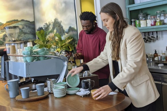 Cloe de la Vaga serves coffee at her Australian cafe Abuelo in Covent Garden, London.