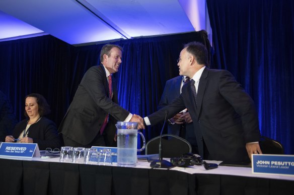 Pesutto greets federal Liberal MP Dan Tehan at the conference.