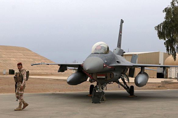 F-16 fighter aircraft are maintained at the Balad airbase north of Baghdad.