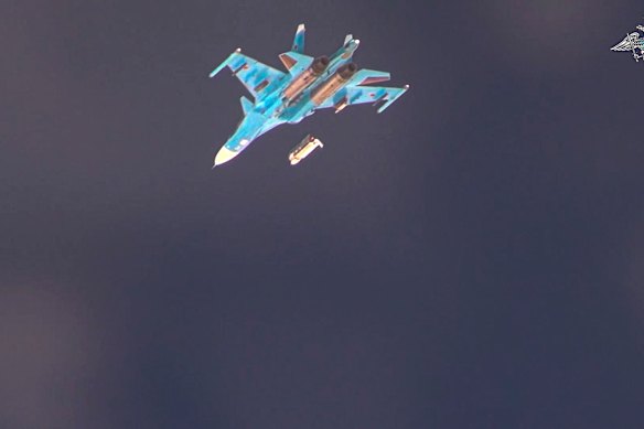An SU-34 drops a glide bomb over Ukrainian positions in an image released by the Russian Defence Ministry last year.