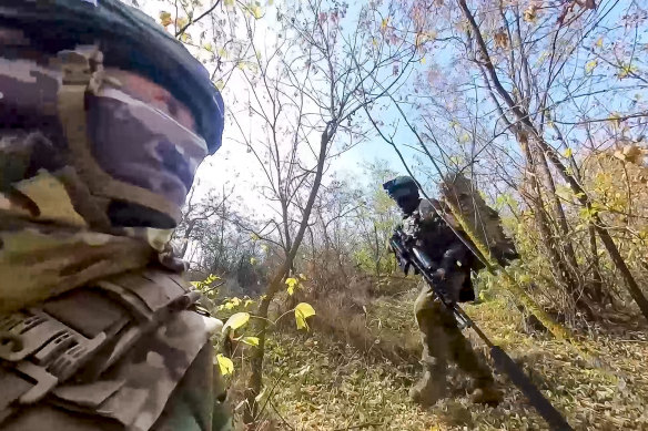Russian army snipers change their position while fighting with Ukrainian armed forces at an undisclosed location in Ukraine. 