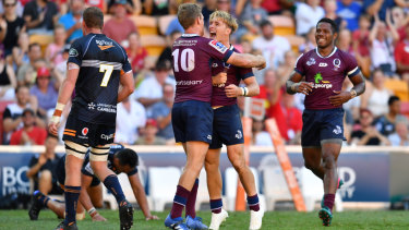 Queensland's Tate McDermott celebrates with Bryce Hegarty in their win over the Brumbies on Sunday.