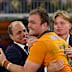  Harry Wilson of the Wallabies celebrates with Phil and Charlie Waugh.