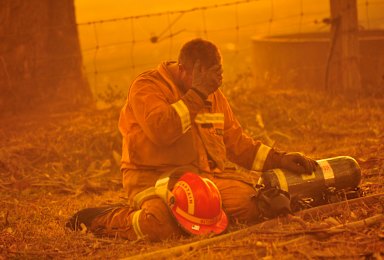 A firefighter reacts as a blaze rages out of control from the Bunyip State Park towards Labertouche and Tonimbuk during the Black Saturday bushfires, which claimed 173 lives in 2009.