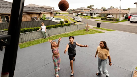 Marian Peters with her children, Emilio, 12, Estelle, 10, and Martina, 8, in Colyton in western Sydney, an area in dire need of more green spaces. 