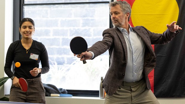 King Frederik plays table tennis during a visit to Headspace South Melbourne, opting in after declining a kick of the footy earlier in the week. The result was decisive — a first-to-five loss.